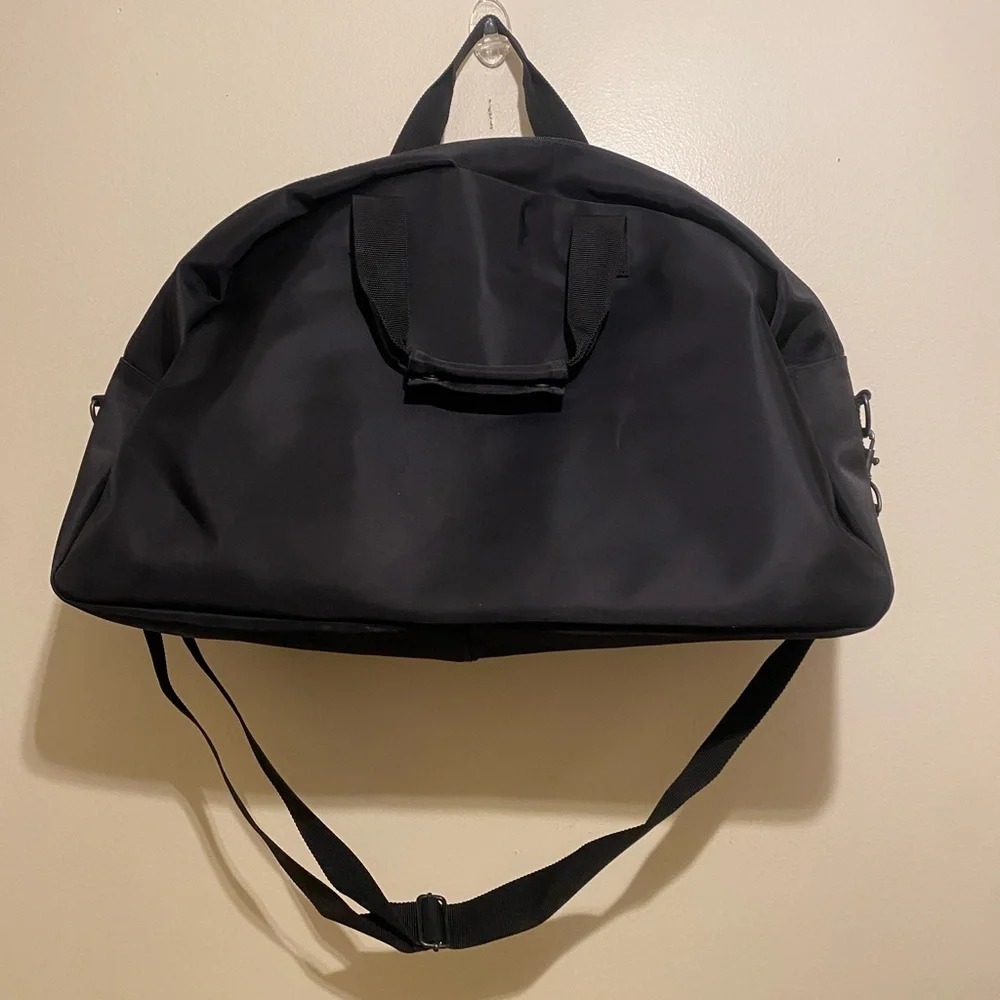 Giorgio Armani Perfums Classic Black Duffel Bag. Unisex model
